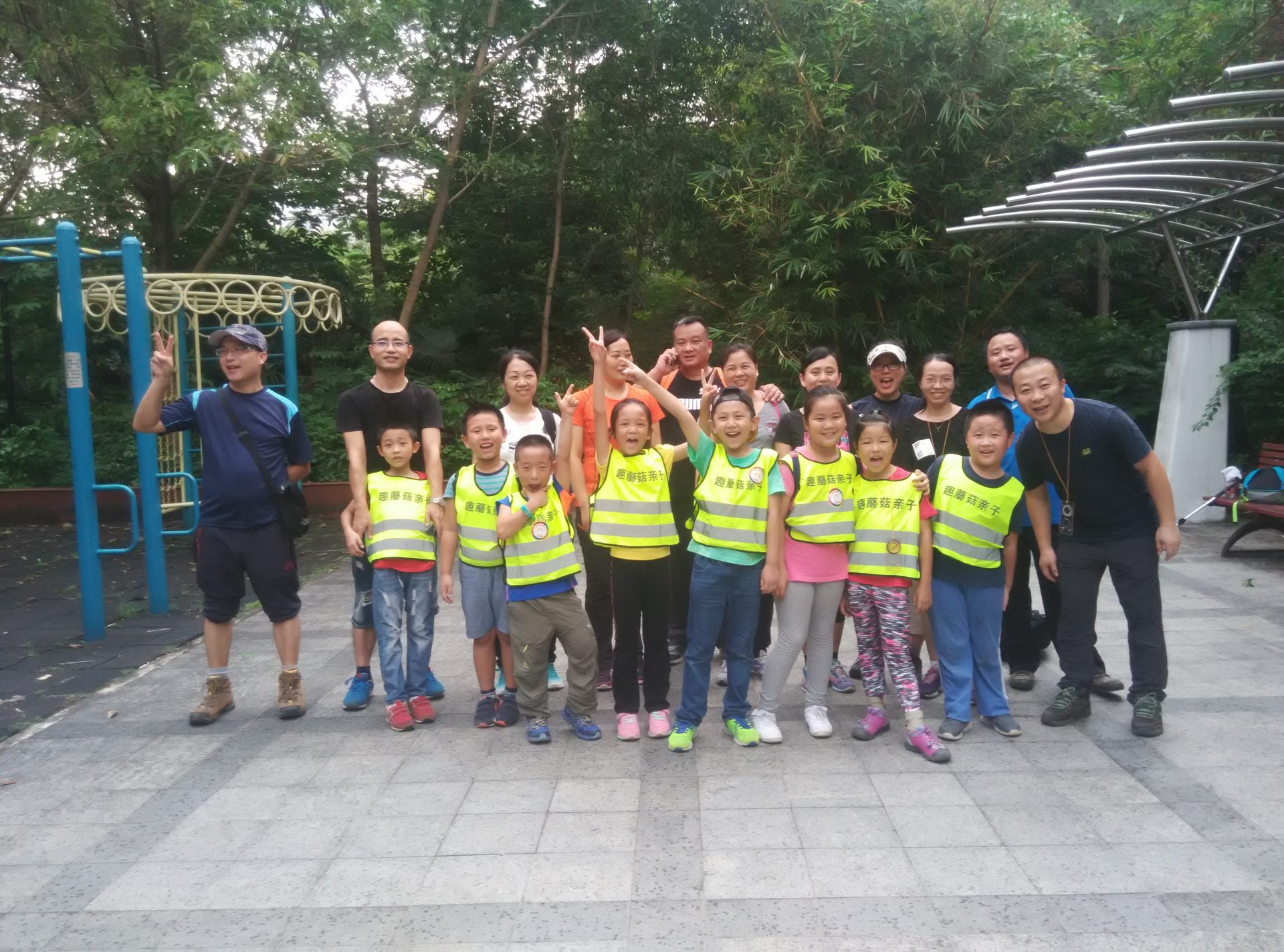 Kids in safety vests at an outdoor activity