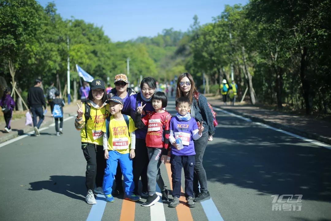 A family in race bibs on the course