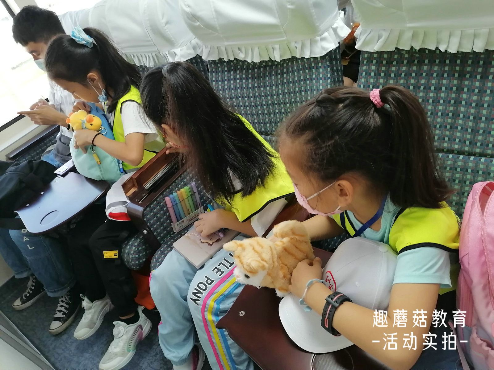 Kids leaning over the railing of the ferry