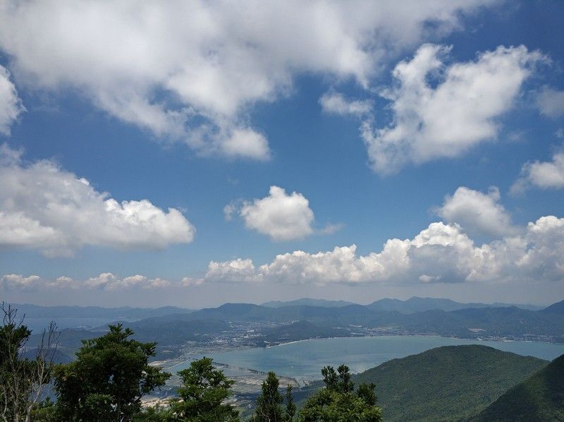 Photographing the mountain view from a viewing platform