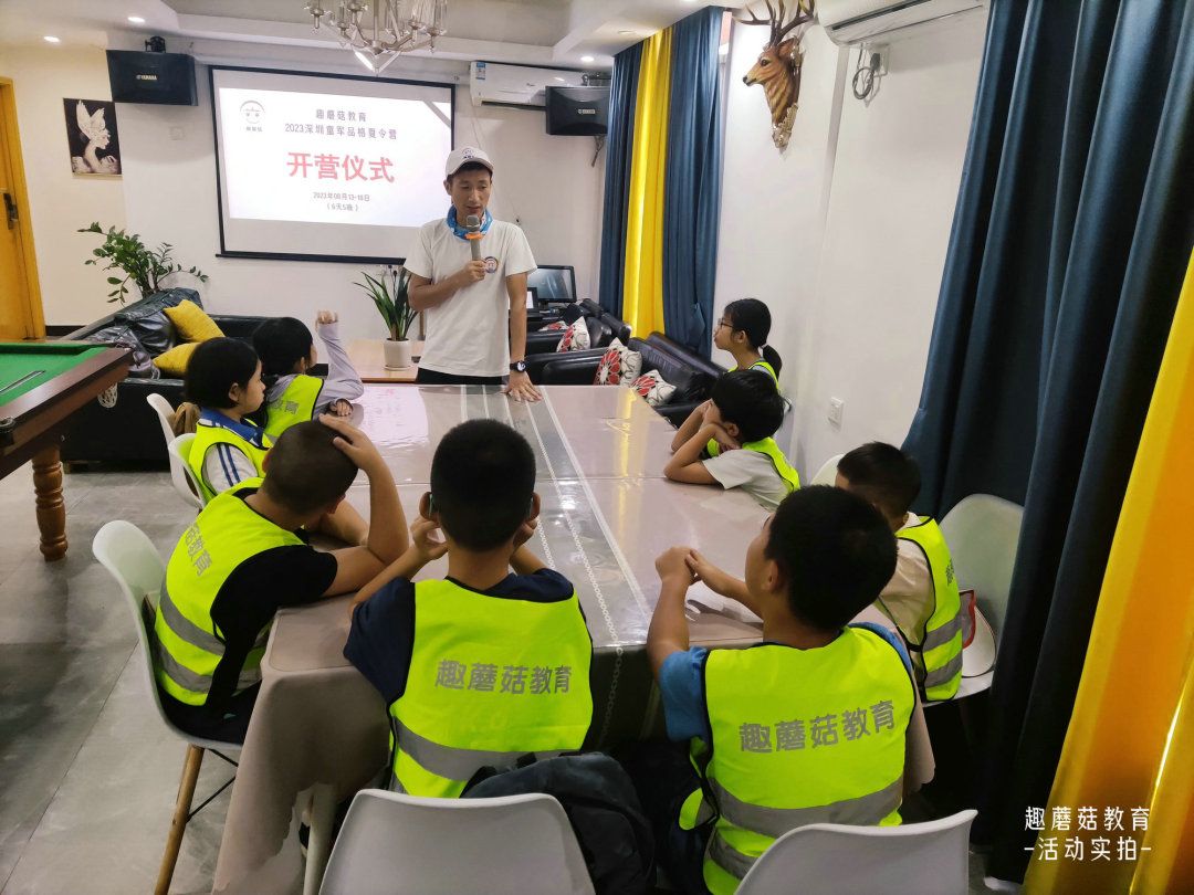 Indoor lesson with campers seated in vests